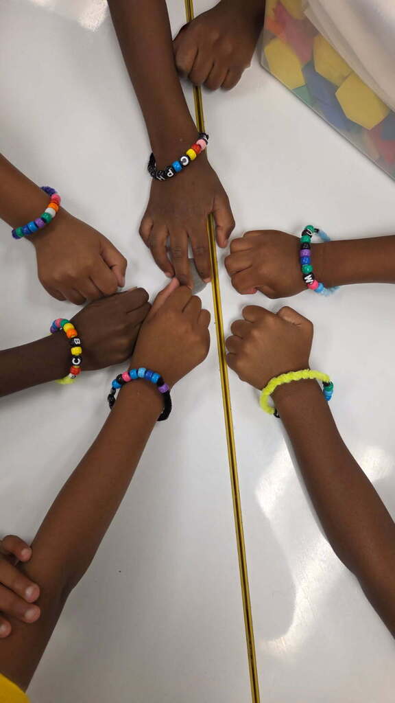 On Friday, Mrs. Benton's Kindergartners made bracelets out of beads as they practiced their touch counting to 10 as a Fun Friday math project.
