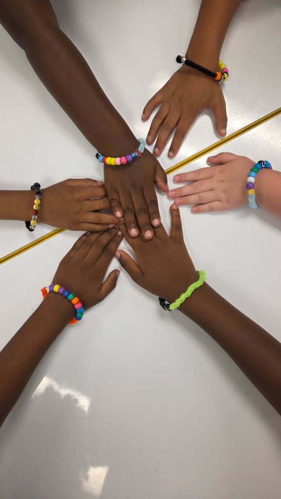 On Friday, Mrs. Benton's Kindergartners made bracelets out of beads as they practiced their touch counting to 10 as a Fun Friday math project.