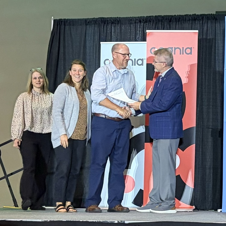 Mr. B and staff receiving an award