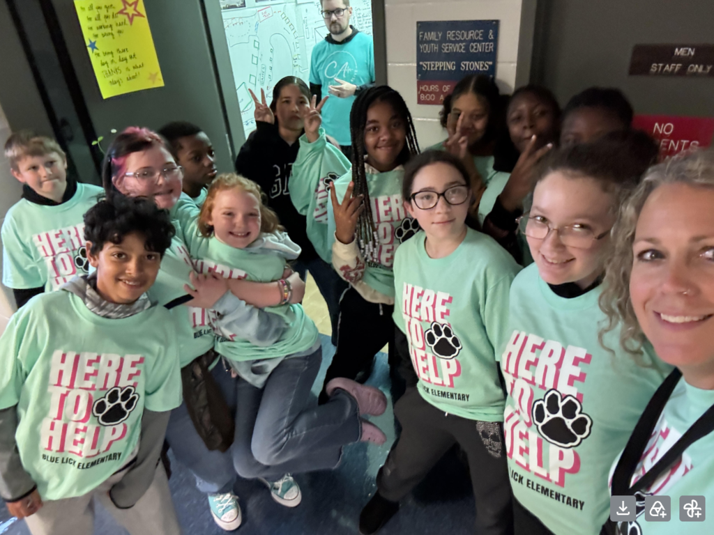 A group of students in their here to help shirts