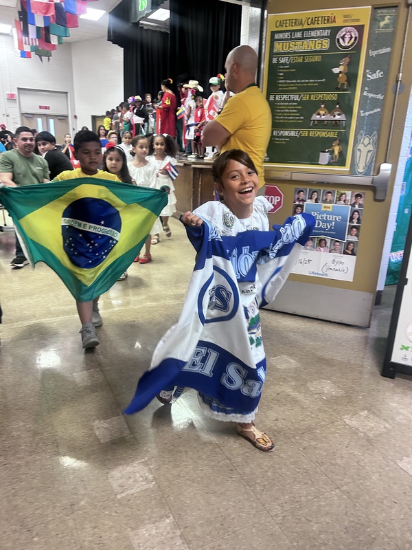 You students carrying flags and big smiles