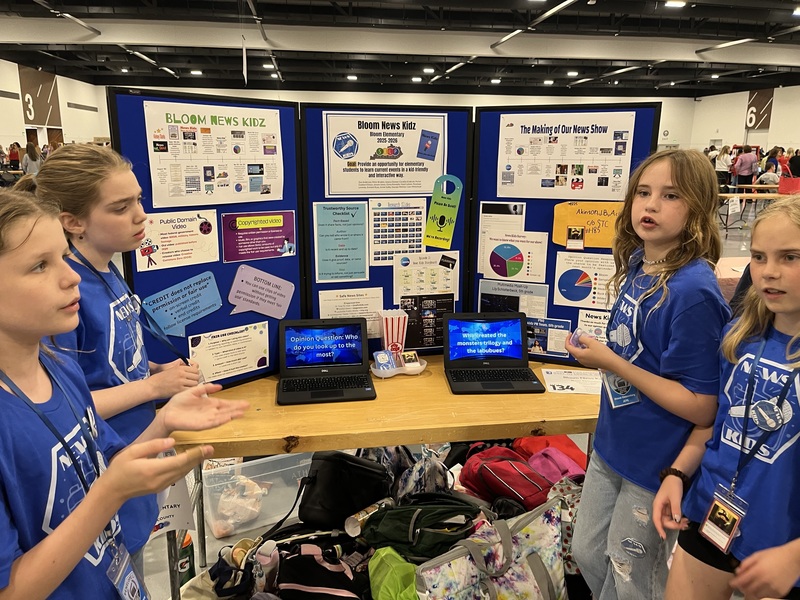 Bloom Elementary students stand near their STLP project.