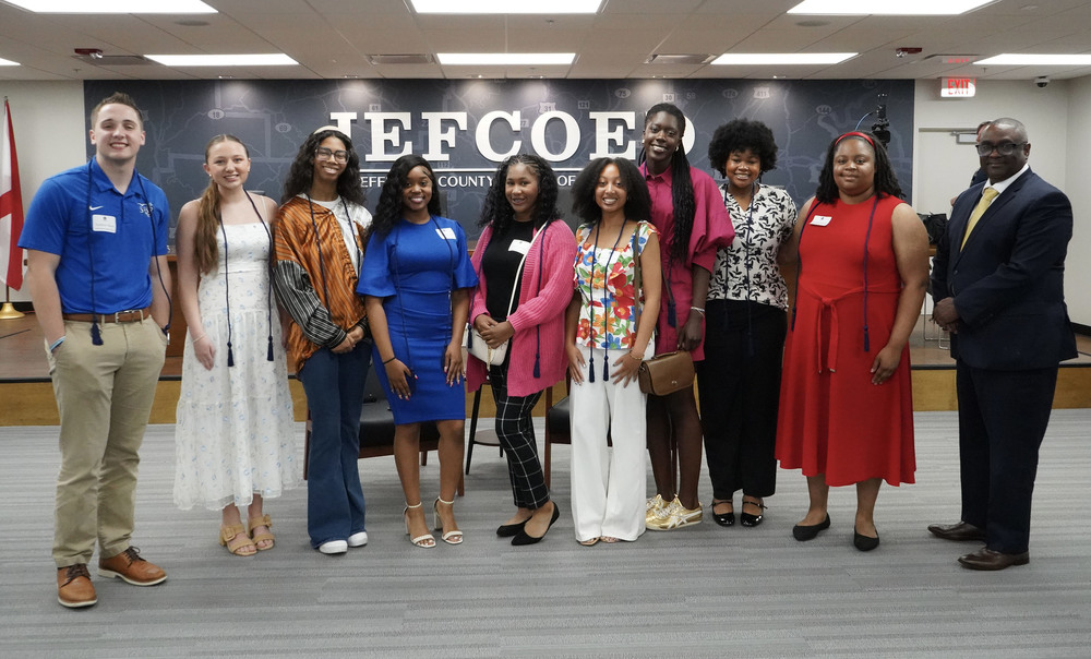 Senior members of the Superintendent's Student Advisory Council stand for a photo with Superintendent Dr. Walter Gonsoulin in the JEFCOED board room.