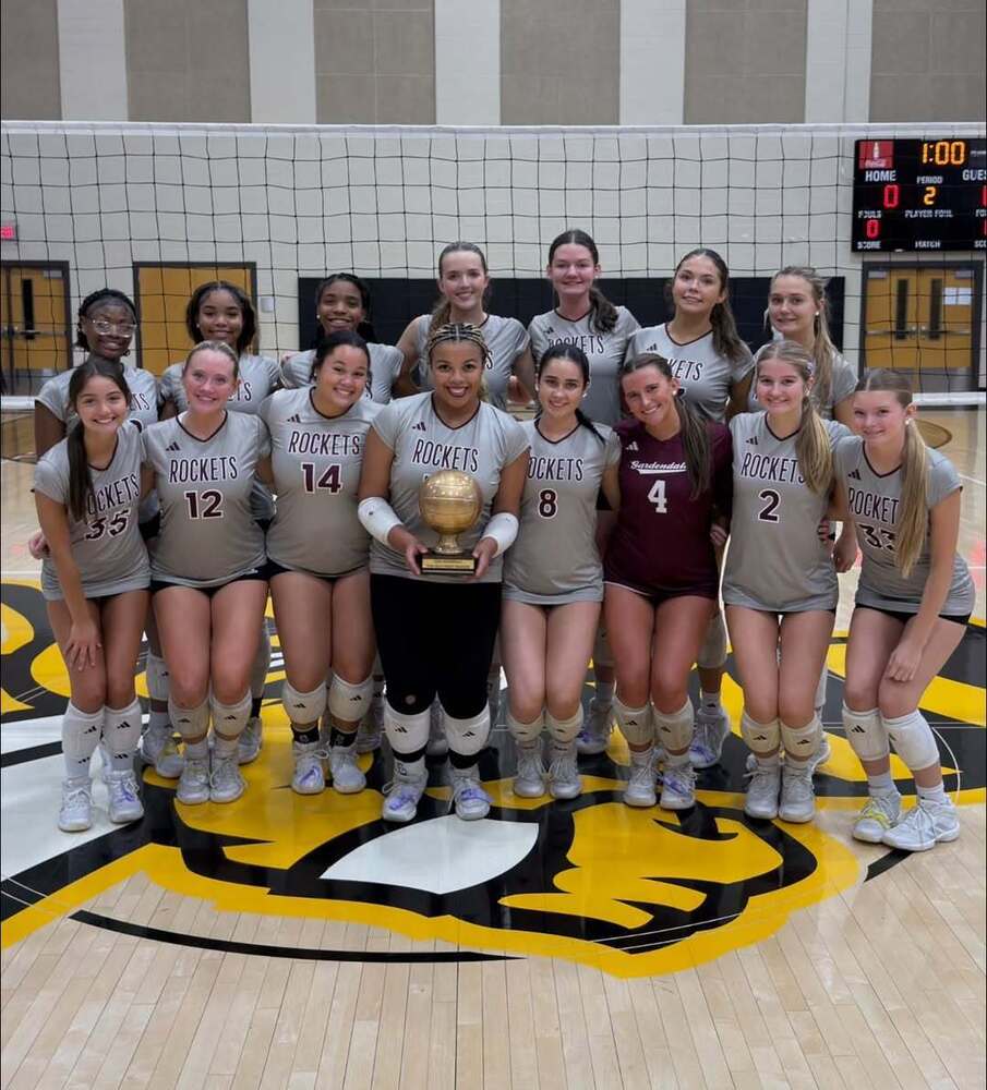 Gardendale High School volleyball players pose for a photo with their trophy after winning the Jefferson County Varsity Volleyball Tournament.