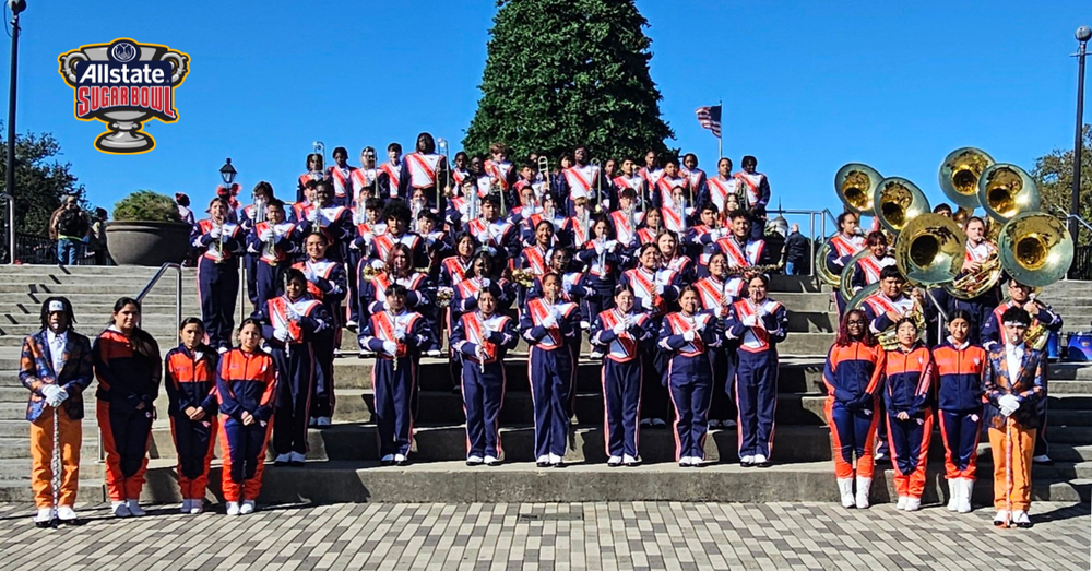 The Fultondale High School band stands for a group picture in Jackson Square in New Orleans, LA. The image includes the Allstate Sugar Bowl logo in the top left corner. 