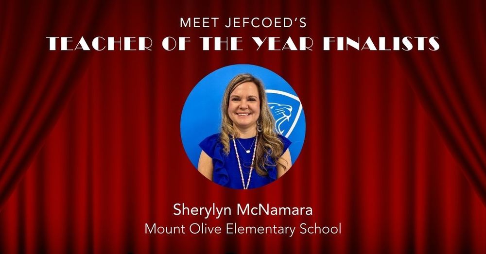 Image is a graphic that says "Meet JEFCOED's Teacher of the Year Finalists" Under the text is a photo of Sherylyn McNamara. Below her photo, her name is typed out, along with the school she teaches at, Mount Olive Elementary School. The text and headshot is placed over a red curtain background.