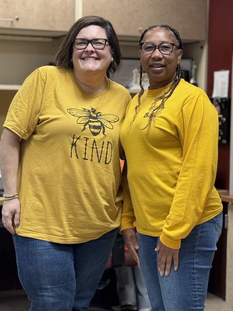 Two female workers smiling