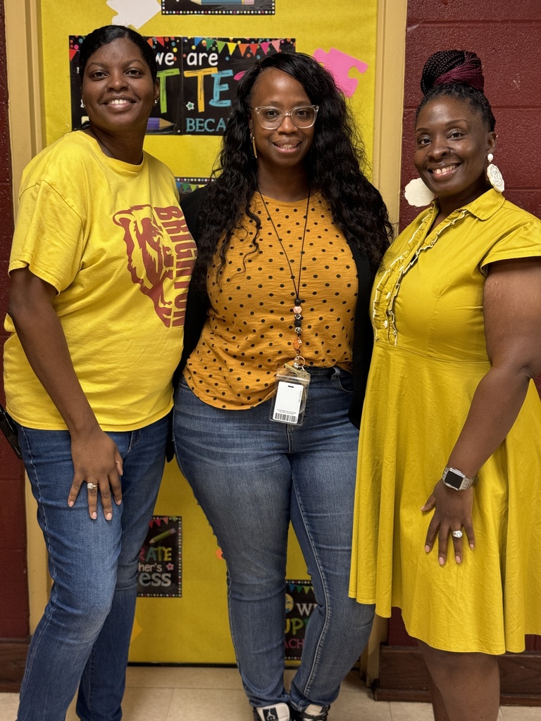 Three teachers smiling