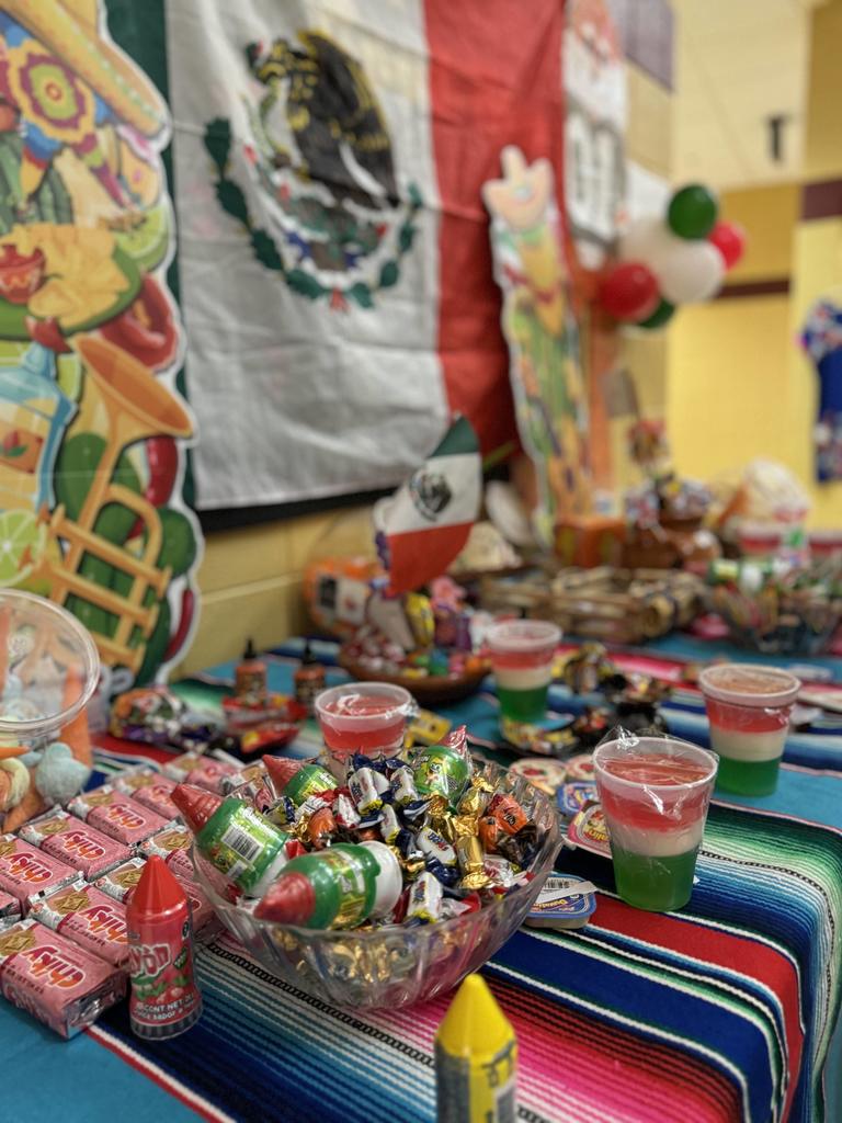 Table decorated with treats and art from Mexico