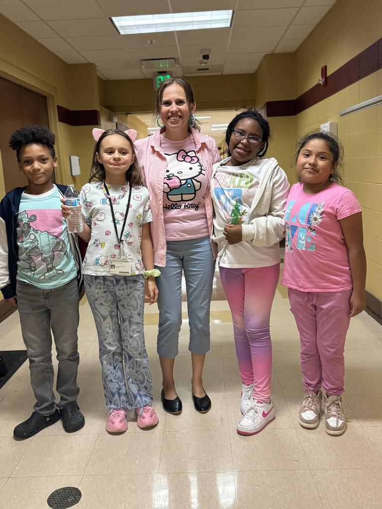 one teacher withfour students smiling