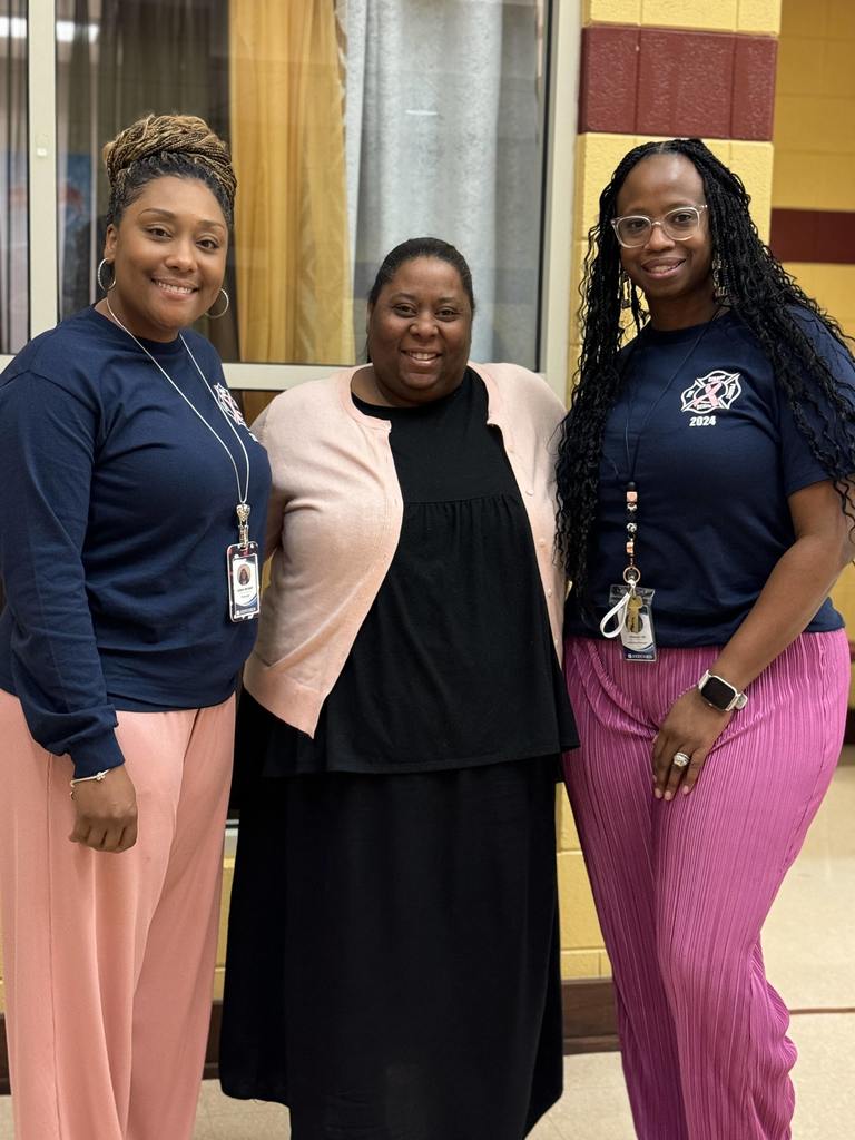 three teachers smiling