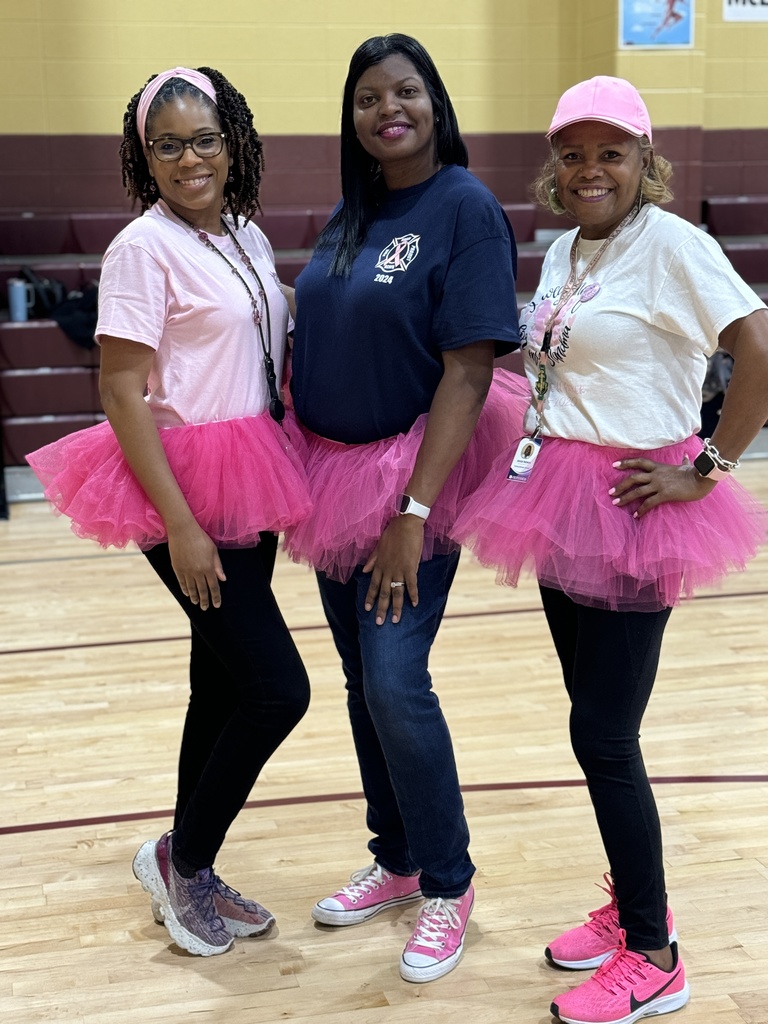 three teachers wearing tutus and smiling