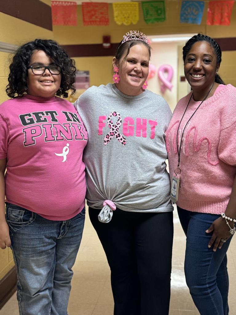 two teachers and a student smiling