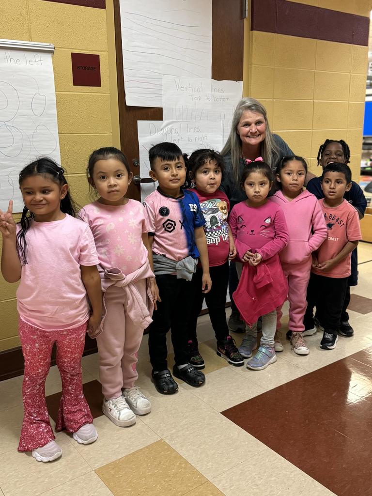 one teachers and her students smiling