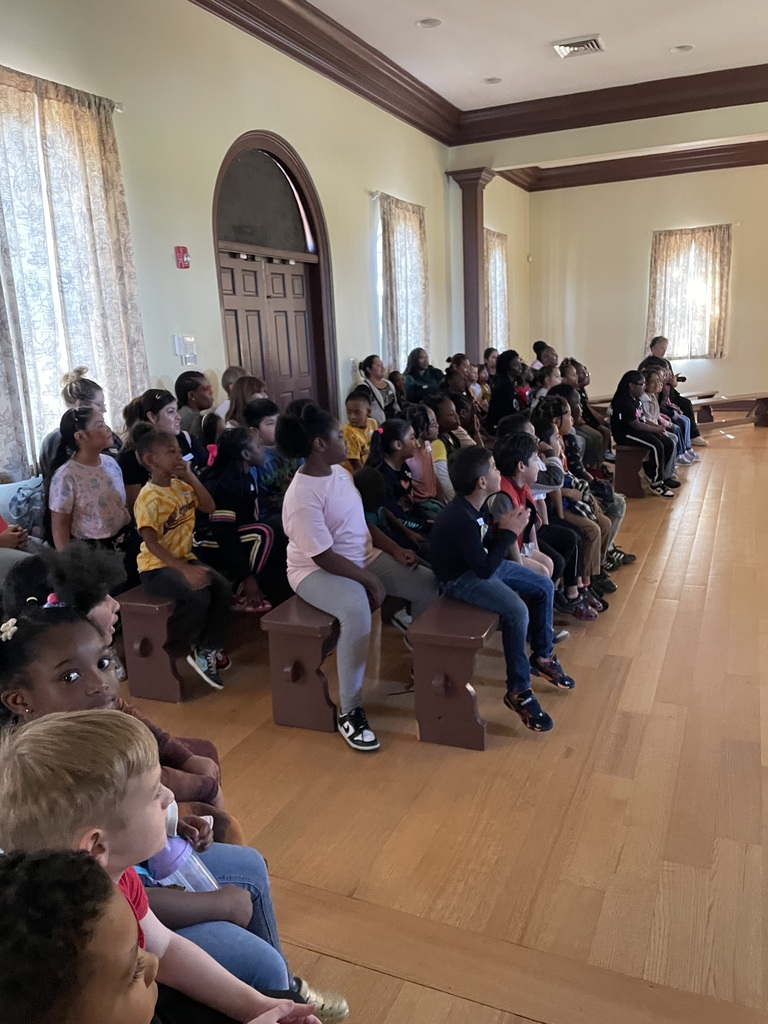 students sitting and listening to a presentation