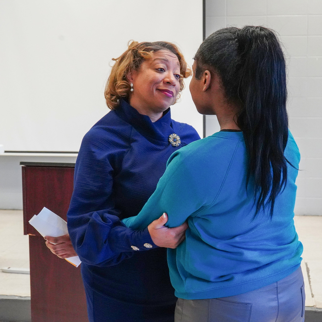 Commissioner Lashunda Scales speaks with a female student.