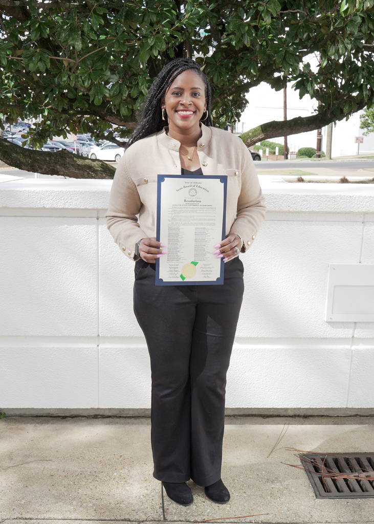 Dr. Monique Stewart, Principal of Chalkville Elementary School holds State Department of Education Resolution