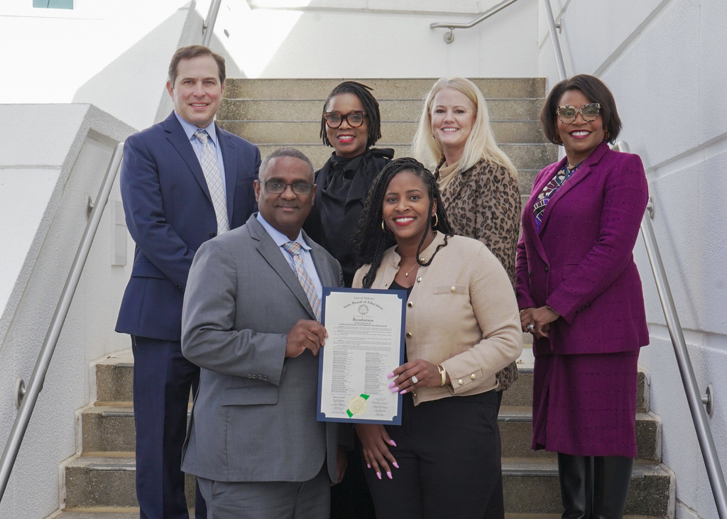 Jefferson County Schools Administration holds Resolution from the State Department of Education recognizing Chalkville Elementary School for school improvement.