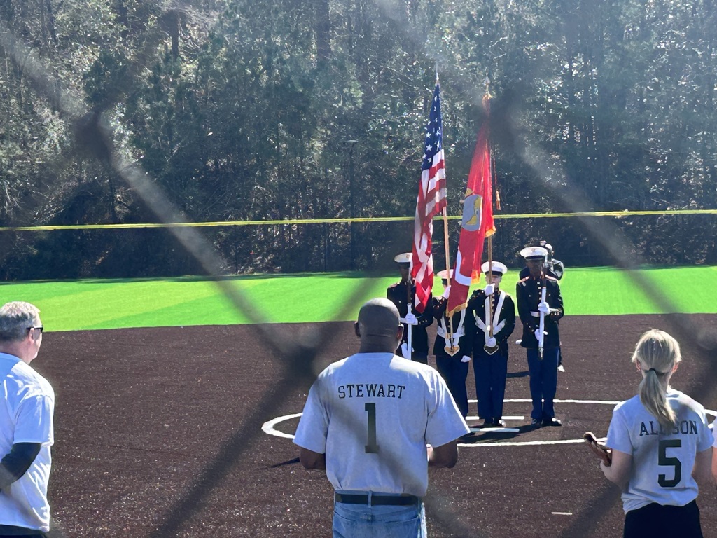 Shades Valley High School JROTC Cadets present the Colors at the grand opening of Irondale's Ruffner Sports Park. They are standing on the center diamond of the baseball field.