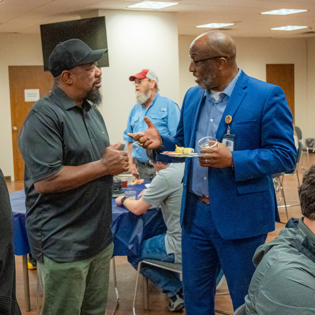 Issac Pettway talks with Bobby Jackson during Issac's retirement party.