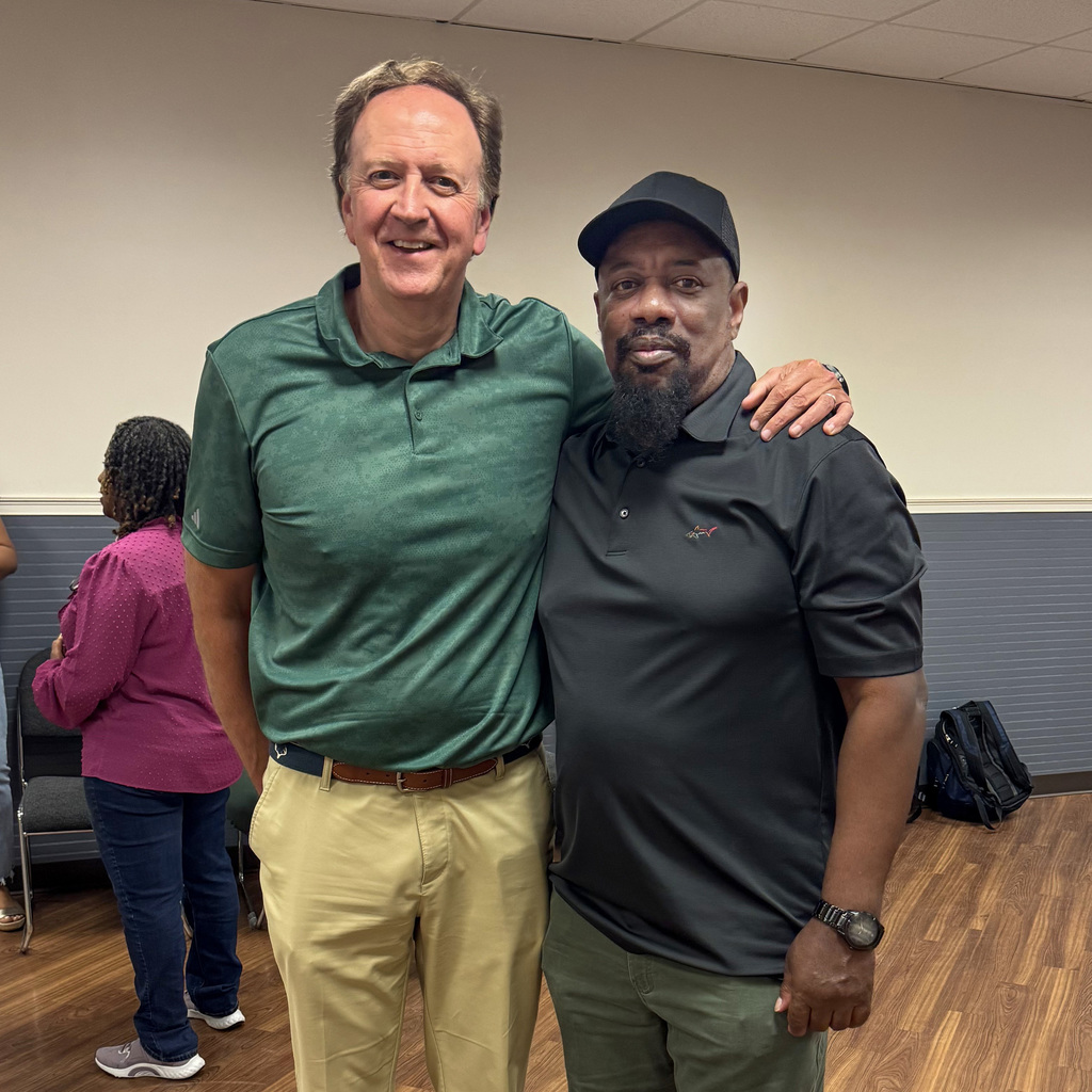 Mr. Shelton Dukes and Mr. Issac Pettway take a picture during Issac's retirement celebration.