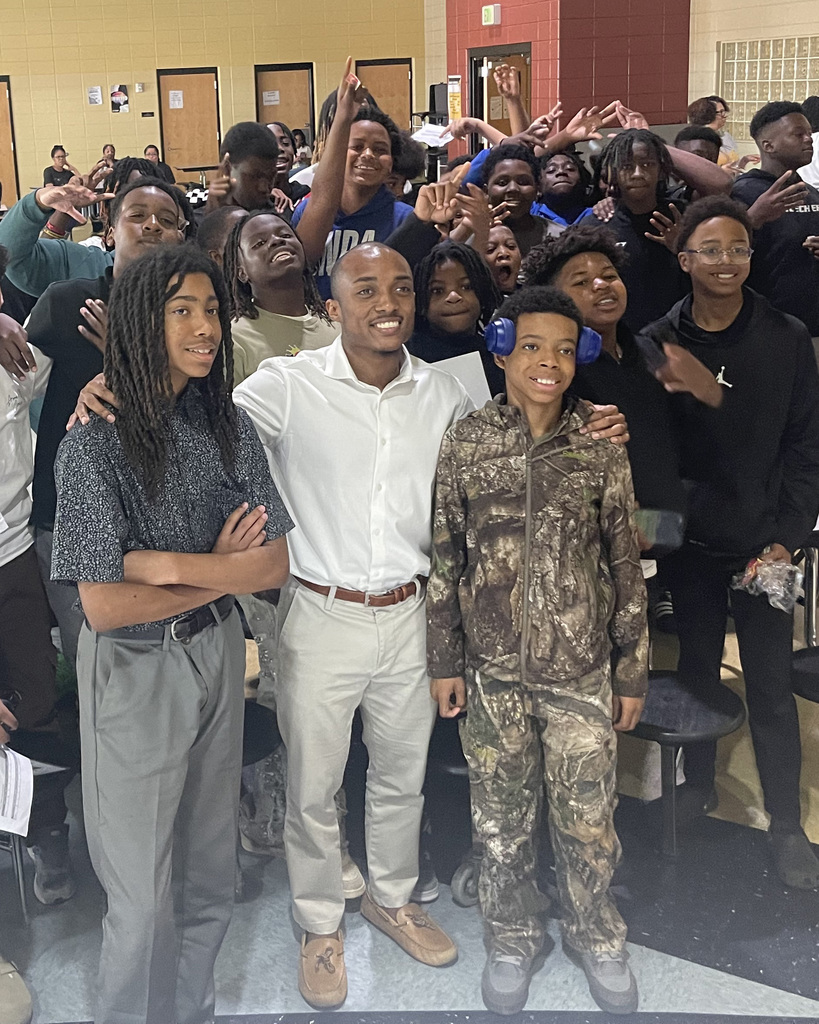 Male students pose for a picture during the Empowerment Summit at McAdory Middle School.