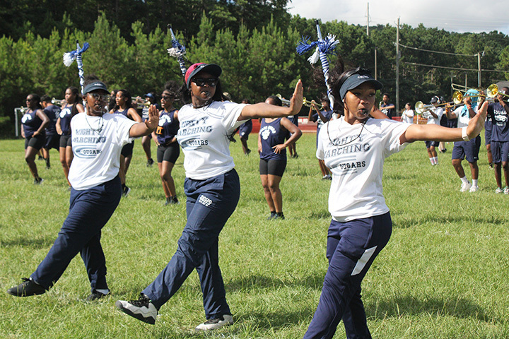 Drum majors performing during practice. 