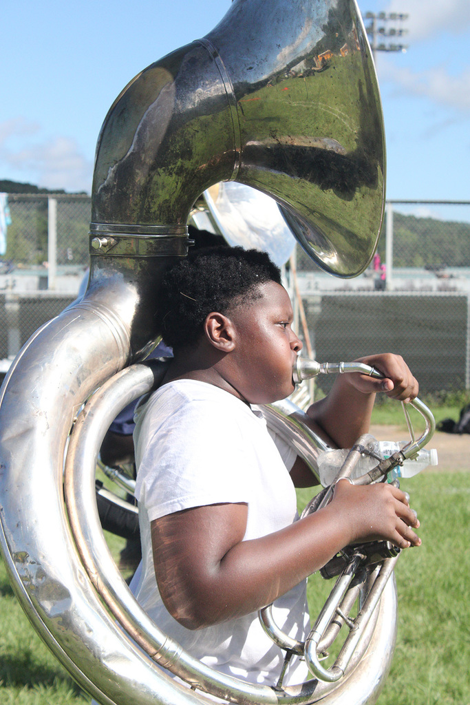 A band student playing tuba during practice. 