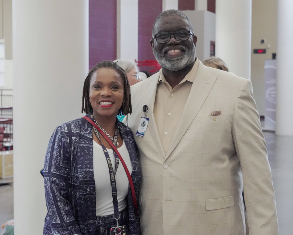 Two school leaders smiling for the camera.