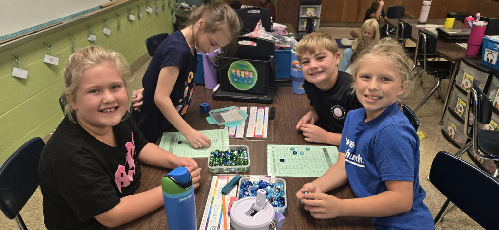 Second graders playing math games