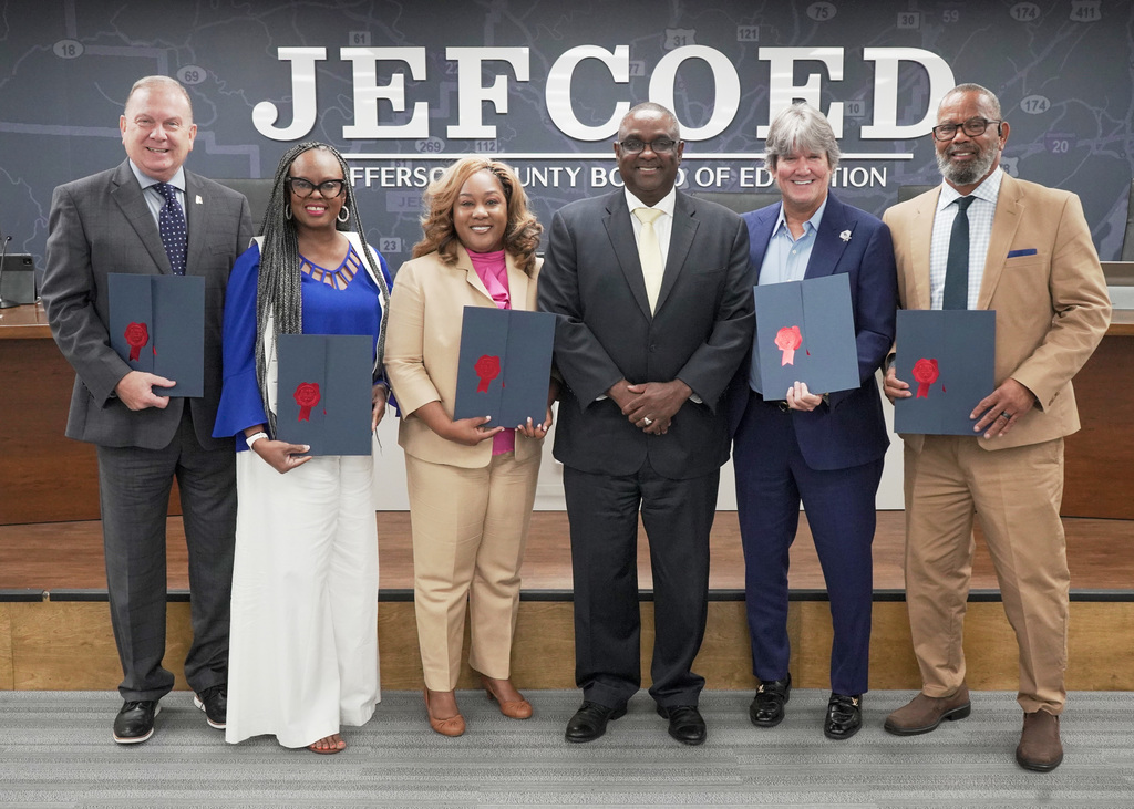 Jefferson County School Board members hold  their certificates from the Alabama Association of School Boards. 