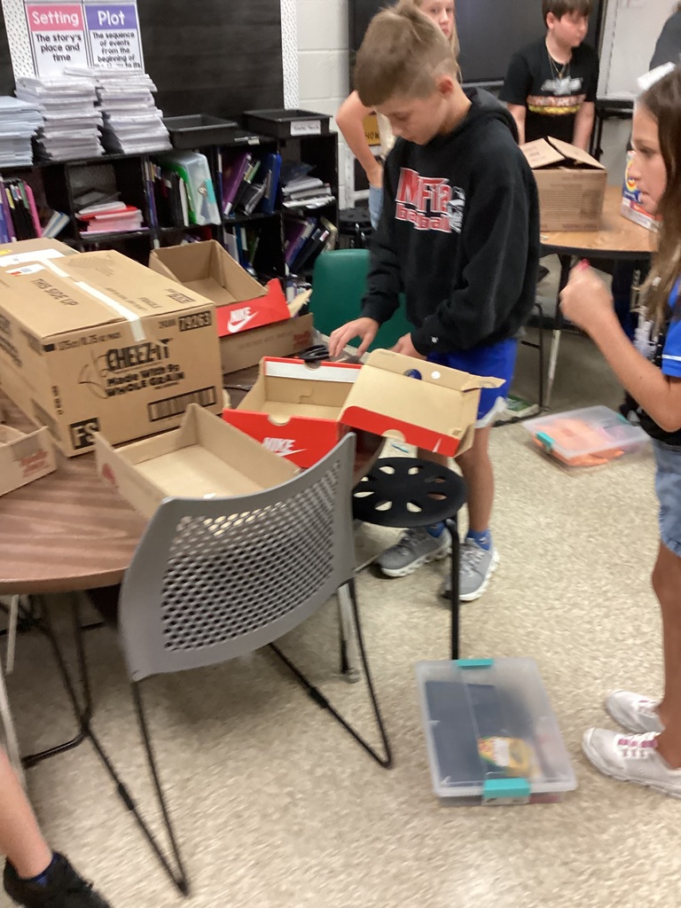 Students working on their volume zoo animals