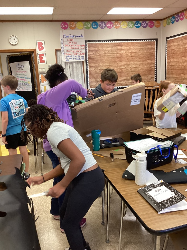 Students working on their volume zoo animals