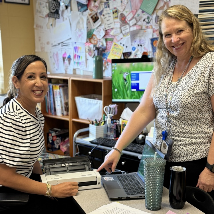 two teachers smiling