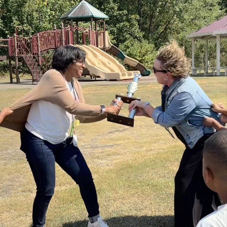 teachers trying to possess a trophy