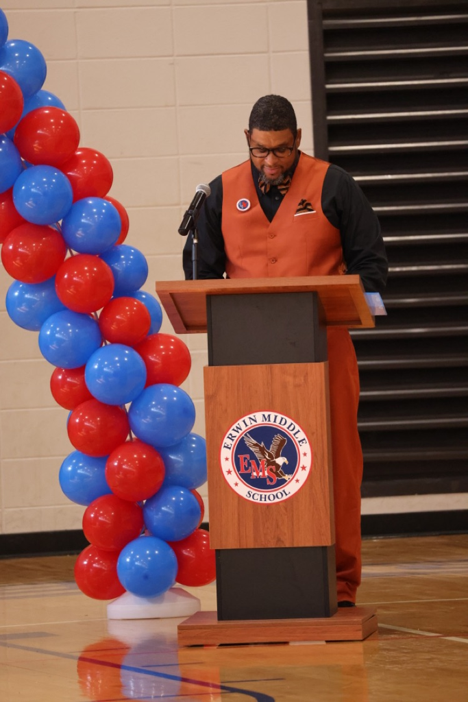 Mr. LeBlanc standing in behind of a podium 