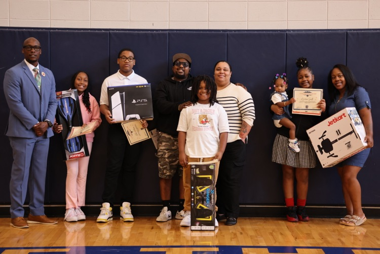 top achieving students with their prizes