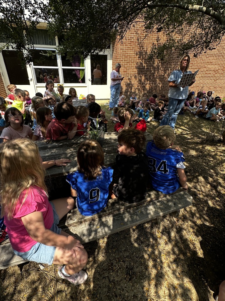 1st grade students with guest reader, Mrs. Wakefield