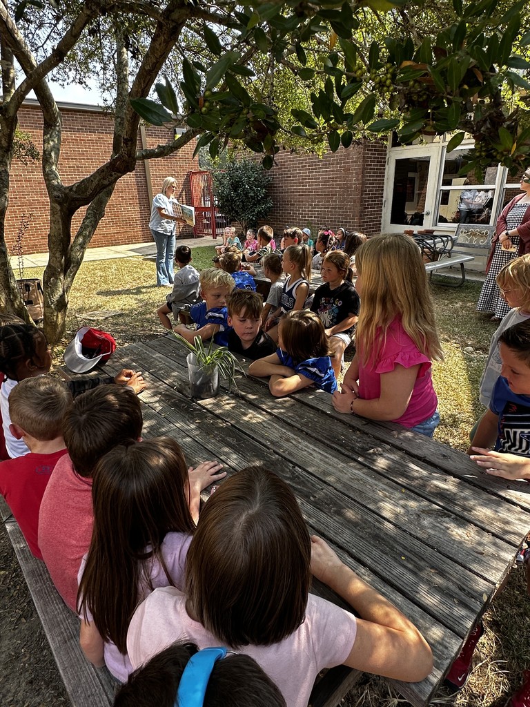 1st grade students with guest reader, Mrs. Wakefield
