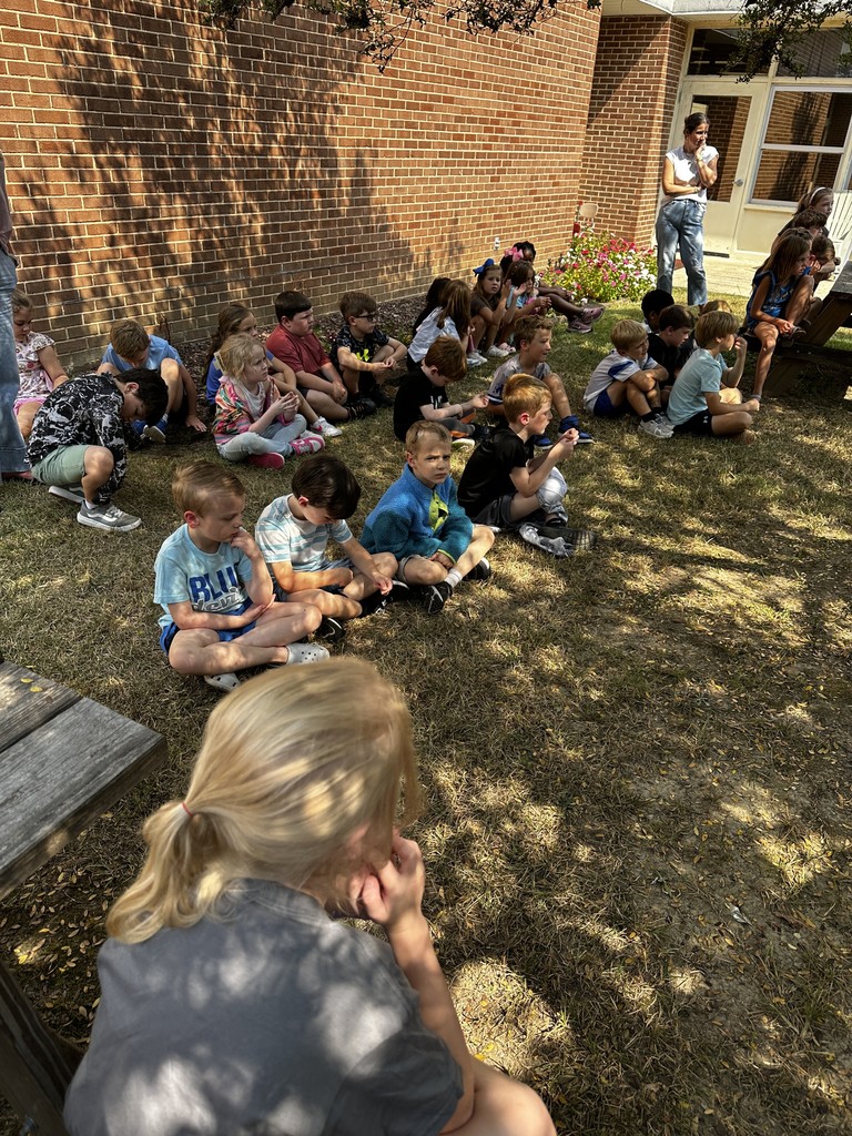 1st grade students with guest reader, Mrs. Wakefield