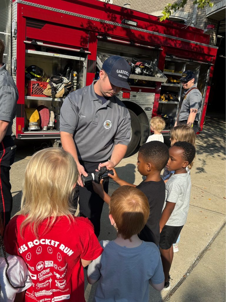 A Gardendale firefighters shows kindergarten students equipment