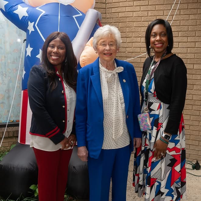 Mrs. Lewis, Gov. Ivey, and Dr. Sellers posing for a picture.