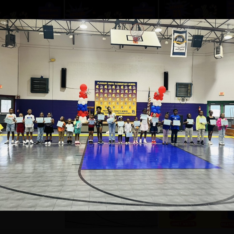A picture of the students holding certificates for being a Good Citizen in August.