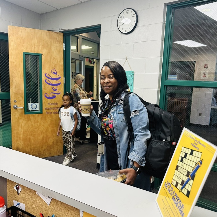 Ms. Sealie holding a beverage from Dolly's.