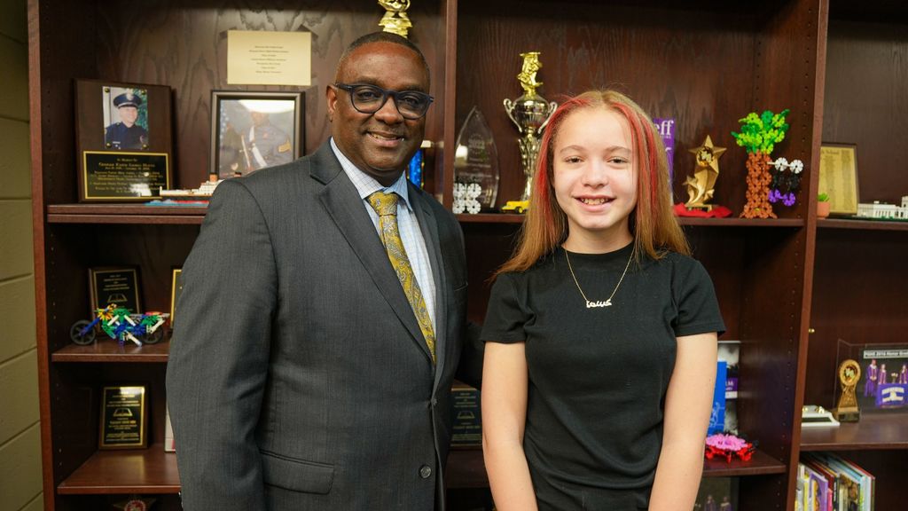 JEFCOED Superintendent Dr. Gonsoulin stands next to a student. Both are smiling at the camera.