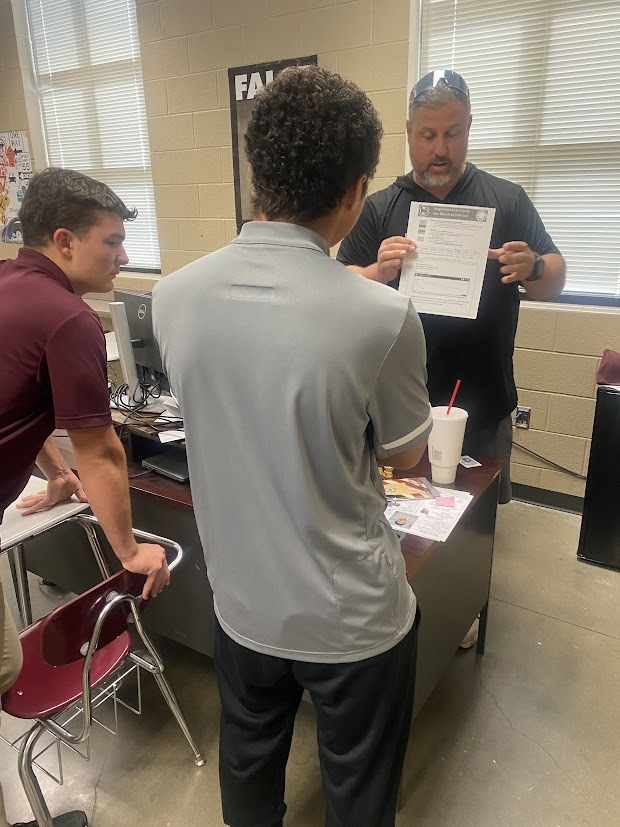 Coach Keedy giving instructions to students after passing their Driver’s test!
