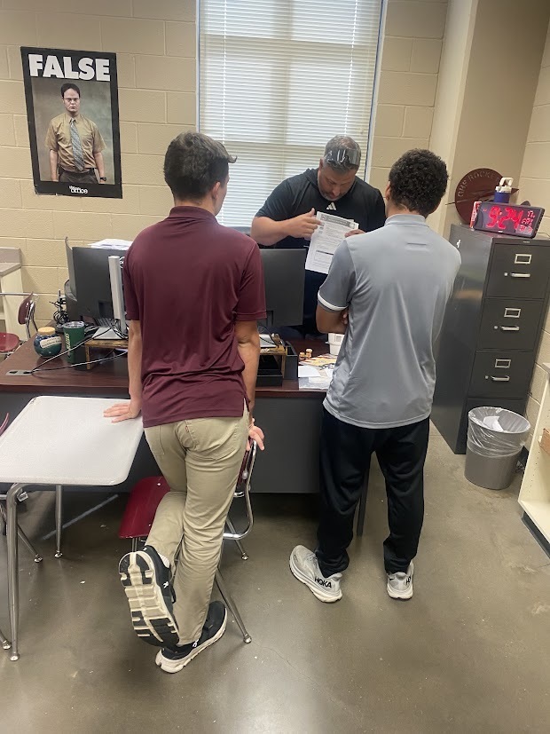 Coach Keedy giving instructions to students after passing their Driver’s test!