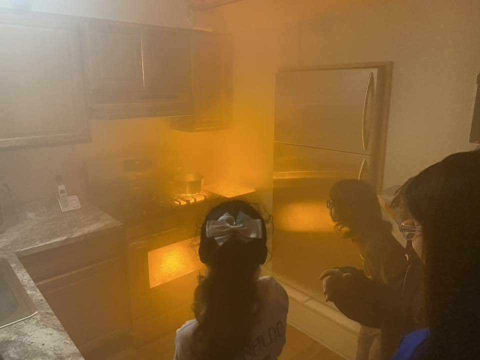 Students participate in a fire simulation.
