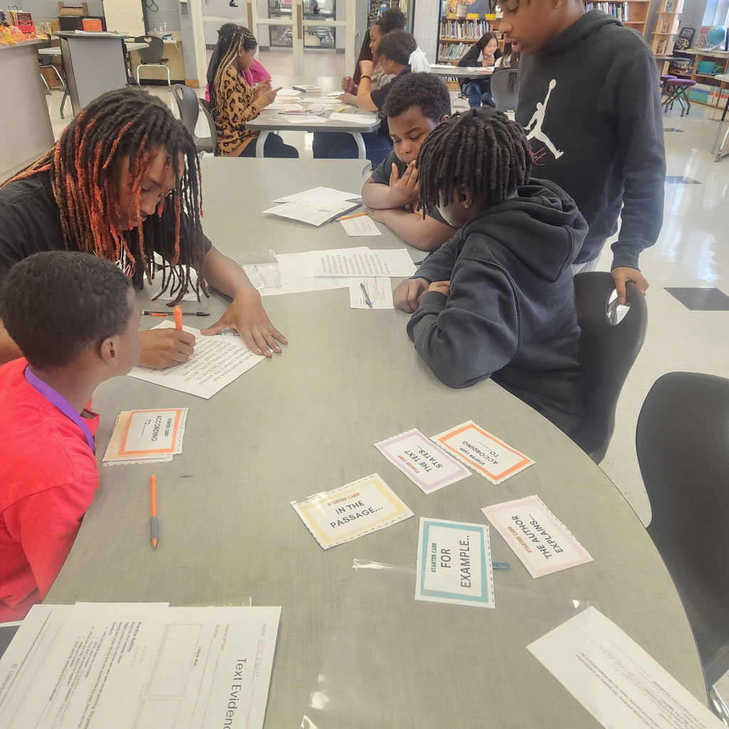 Students discussing how to cite sources.
