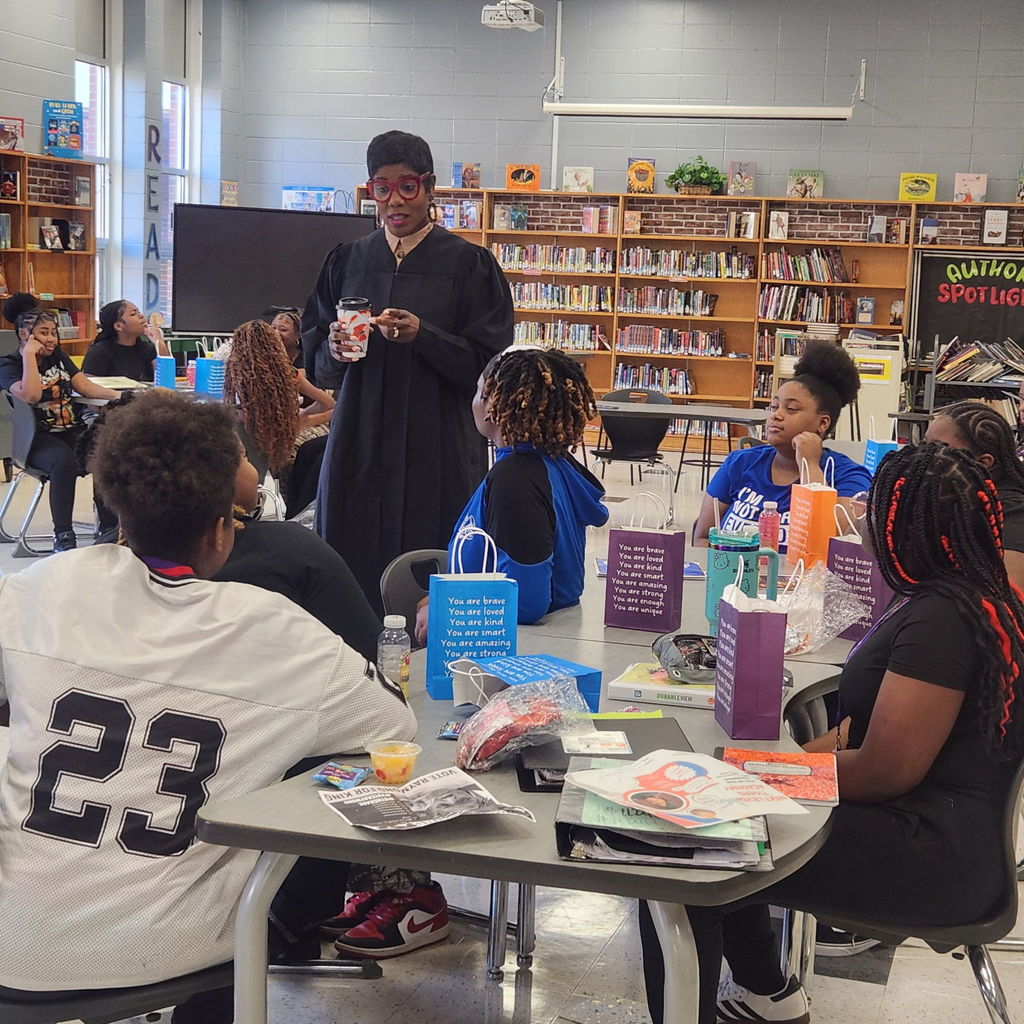 Students listen as Judge speaks.
